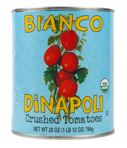 A large can of crushed tomatoes, with a pale blue label, red tomatoes, and yellow letters saying Bianco DiNapoli.