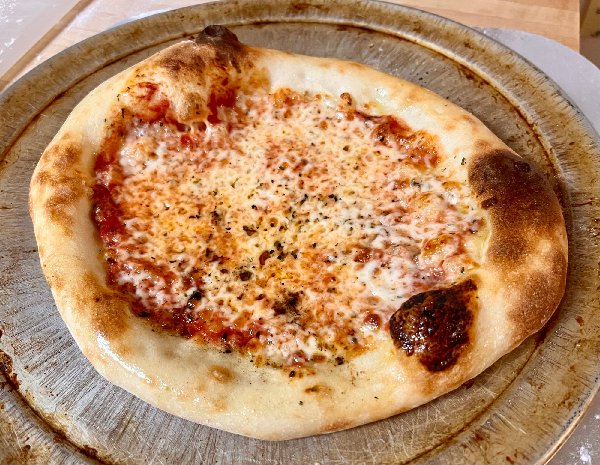 A cooked cheese pizza