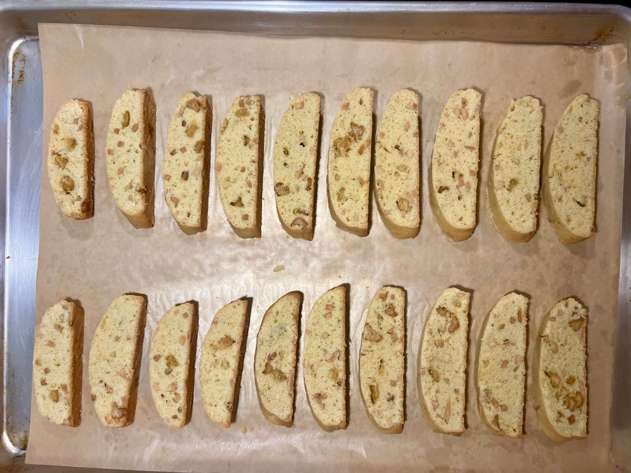 The individual cookies are arranged back onto the parchment-lined baking sheet. They won't grow more, so they're only about a 1/4 inch apart.